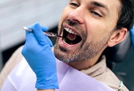 a patient receiving a dental examination