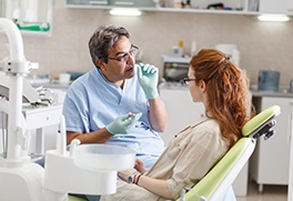 A patient talking to her male dentist