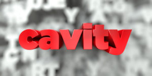 Sign that says “Cavity” in red letters