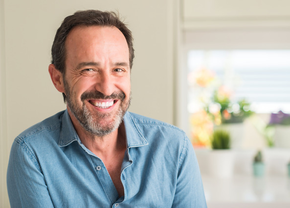 man smiling while inside home