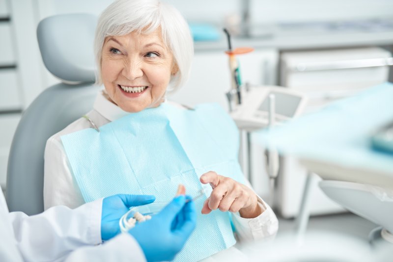 dental implant consultation with older woman