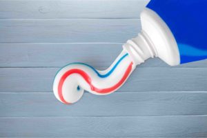 Toothpaste being squeezed
