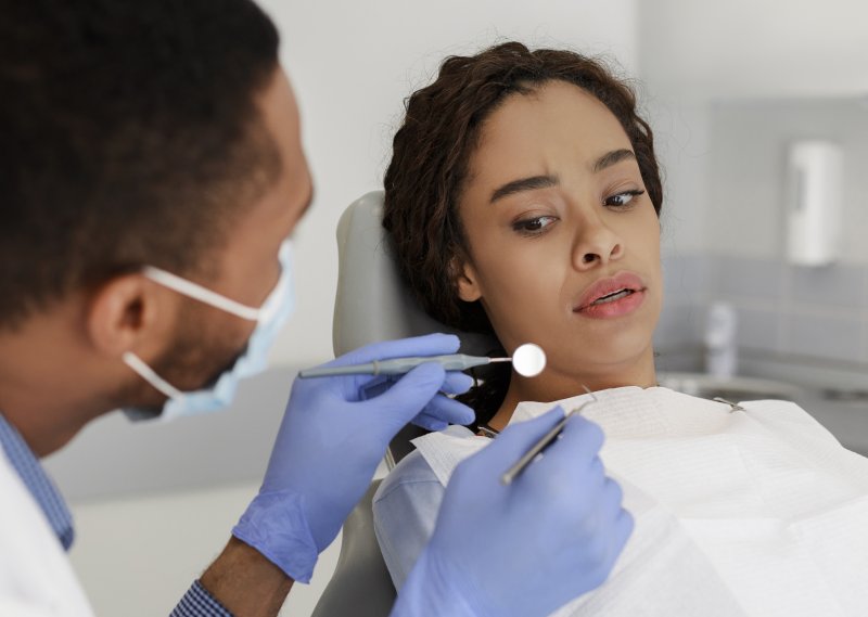 Woman feeling anxious during dental exam