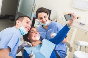 Patient taking selfie with dentist